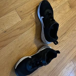 Boys Black and White Nike sneakers